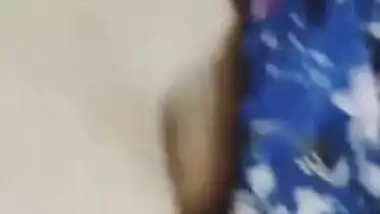 Desi woman in floral robe teases lover demonstrating big breasts
